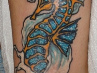 Татуировка морской конёк на щиколотке