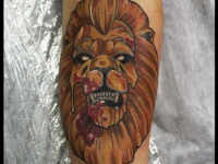 Татуировка морда льва на предплечье