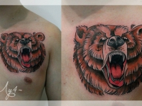 Татуировка голова медведя на груди