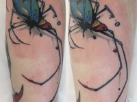 Татуировка паук на икре
